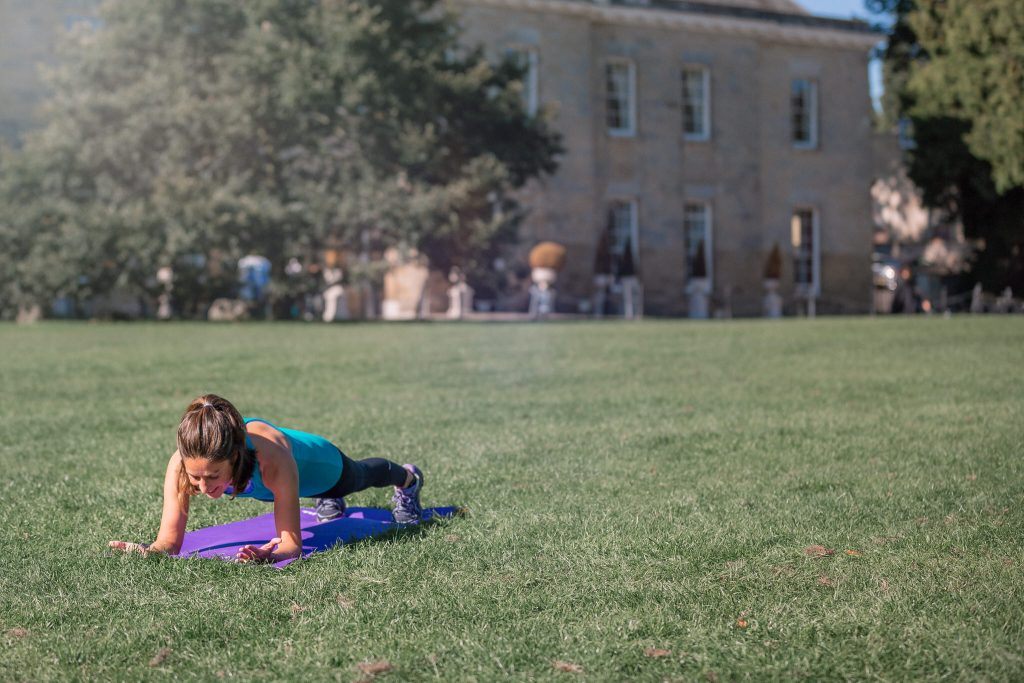 Woman engaging core in plank exercise